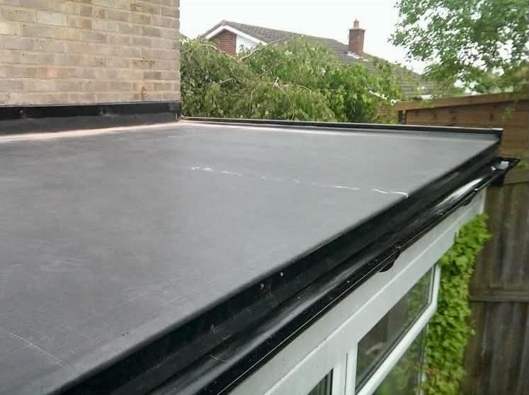EPDM rubber roof edge trim detail on a home extension