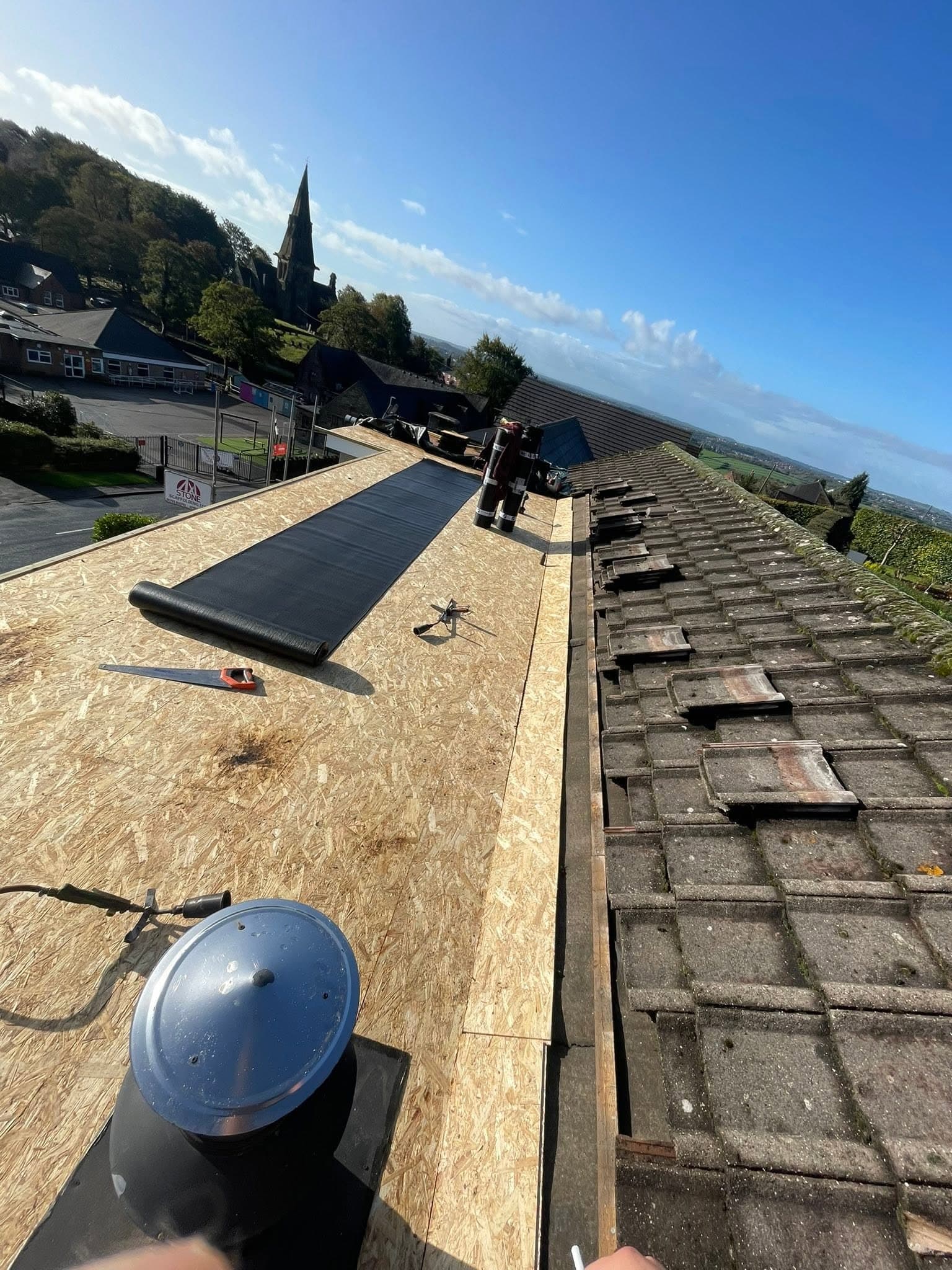 New timber deck and underlay being torched on during a felt re-roof in Staffordshire