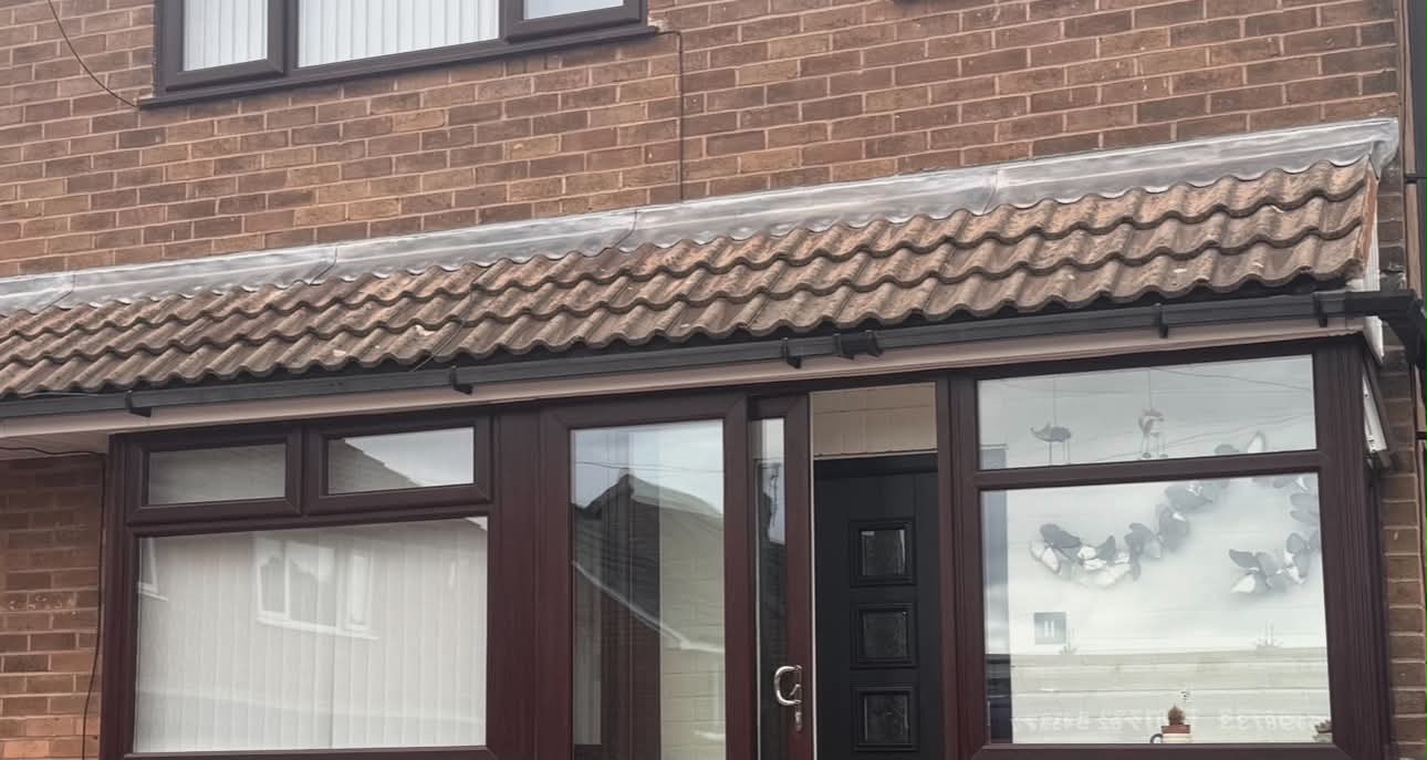 New leadwork fitted along the top of a tiled porch roof